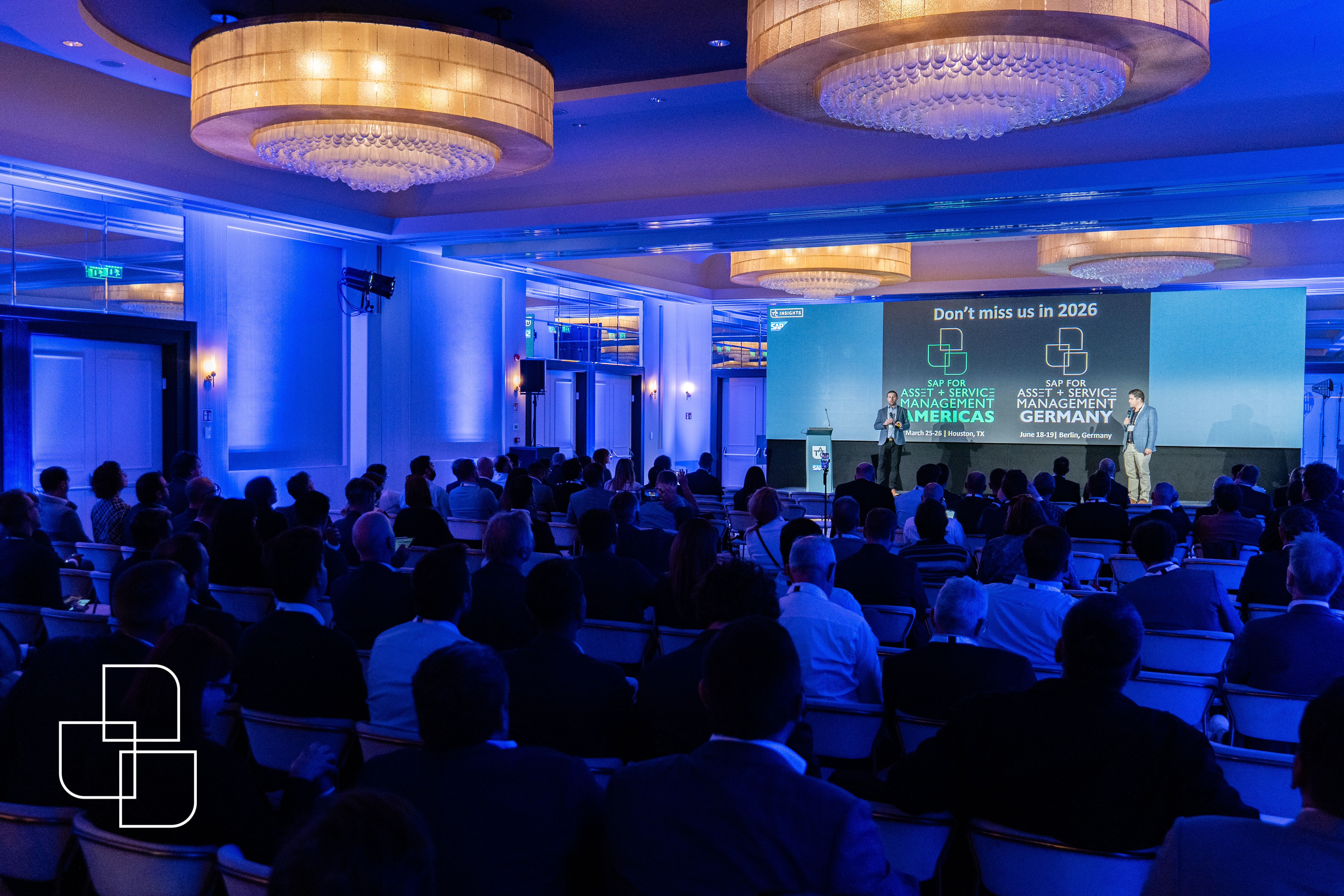 Rome conference main room with attendees sitting down listening to a talk