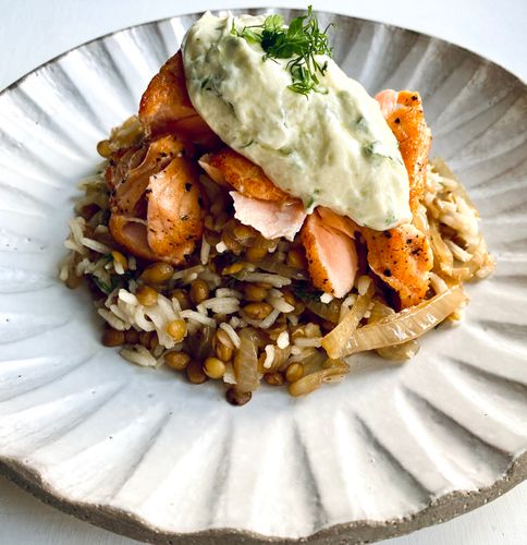 Irini Tzortzoglou’s rice, lentils and caramelised onions with pan-fried salmon and herb yoghurt sauce