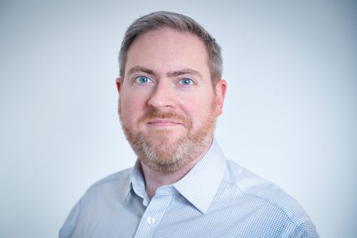 Speaker profile image for Adrian Quigley