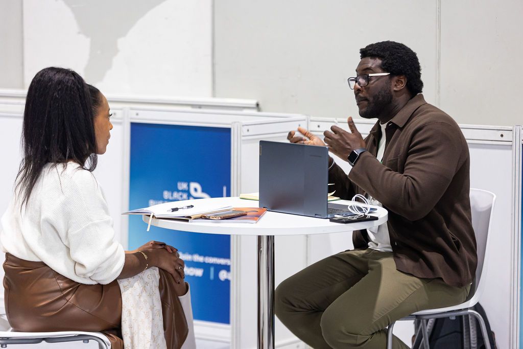 Image shows a 121 meeting between an adviser and an attendee