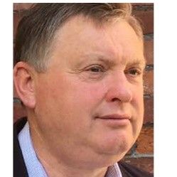 Speaker profile image for Adrian James