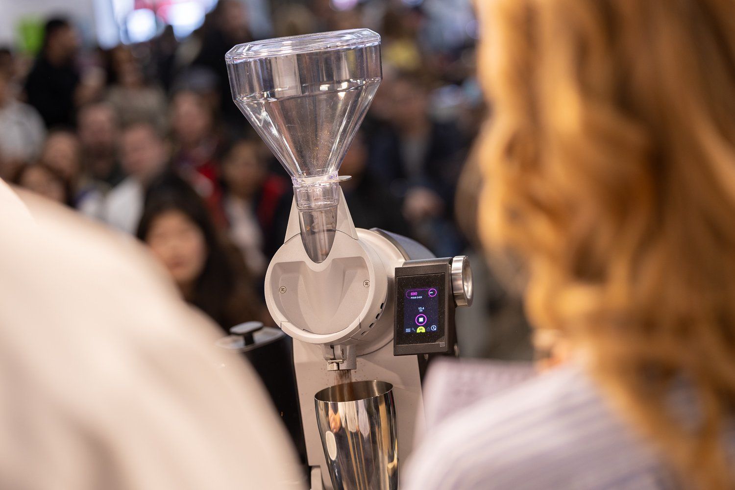 Coffee grinder in use at The London Coffee Festival