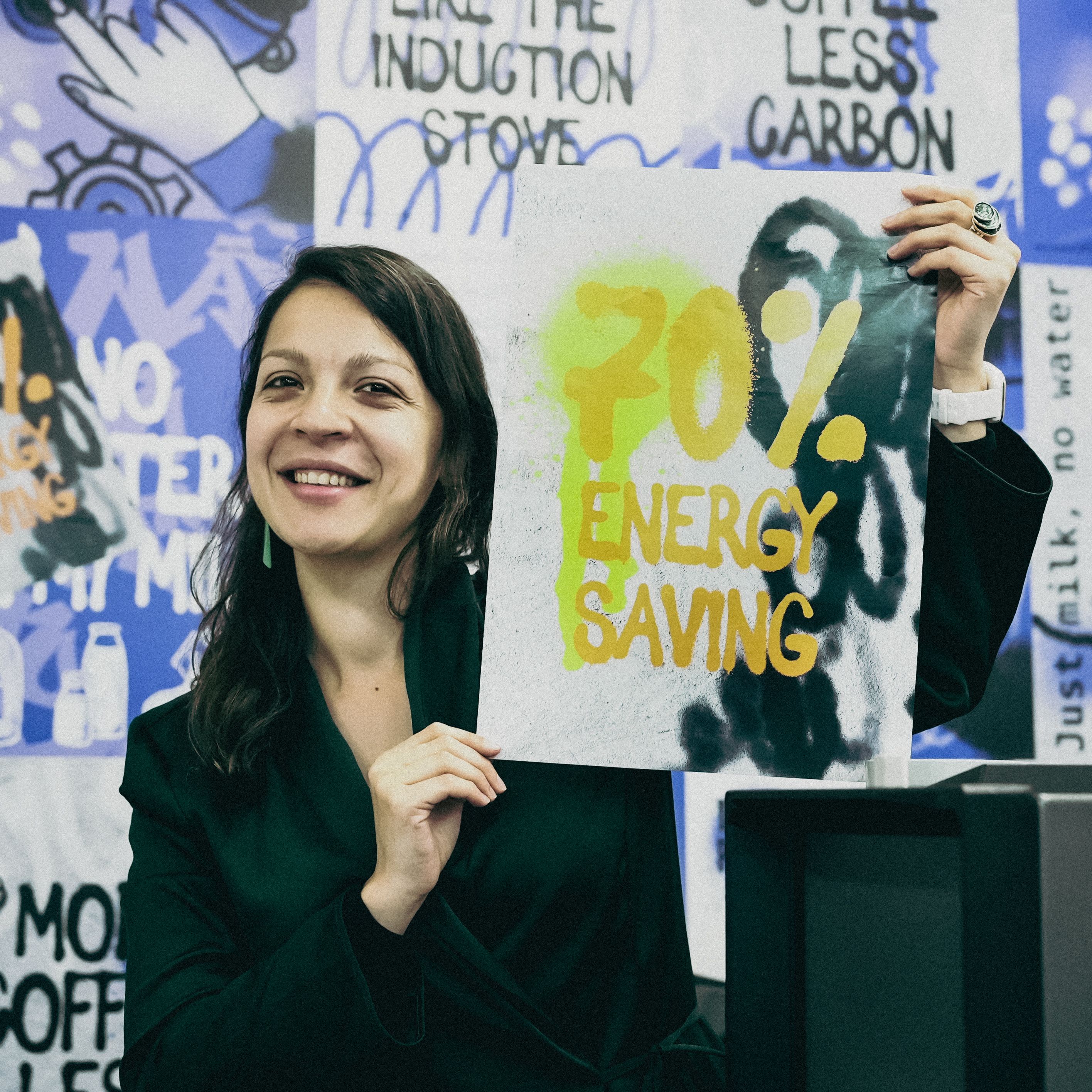 Woman smiling with poster