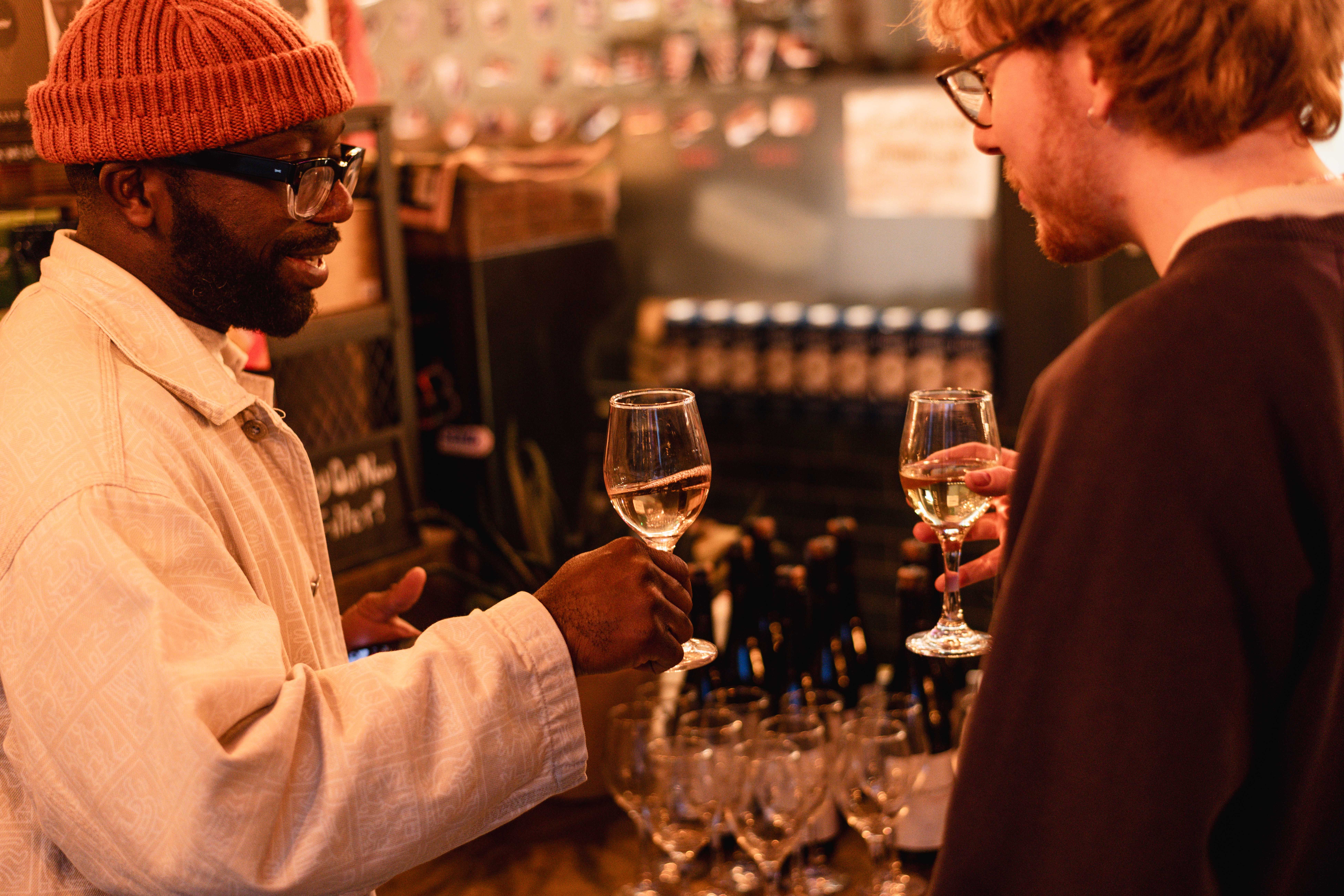 Two men clinking glasses at an event