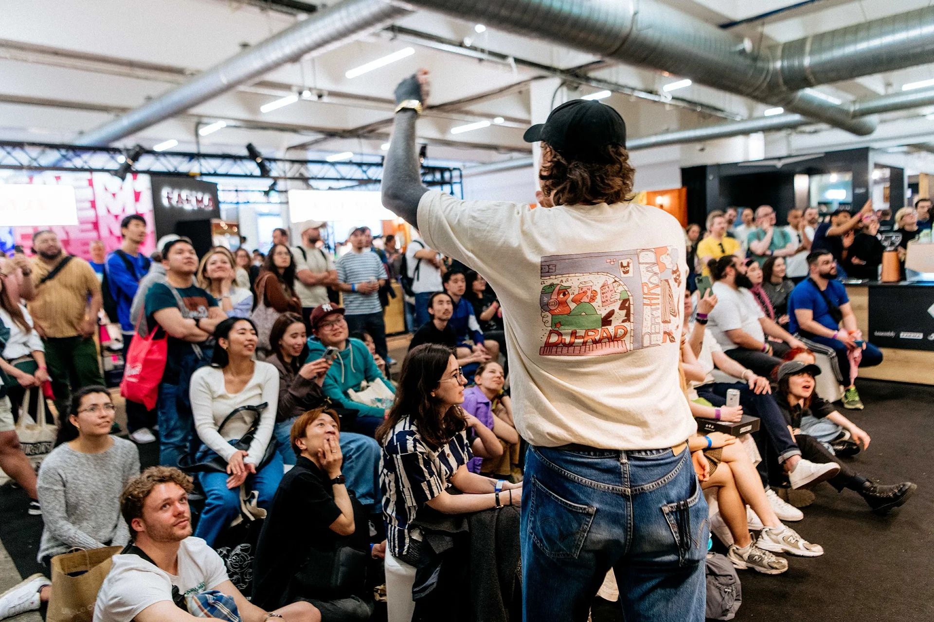 Man speaking into mic in front of audience